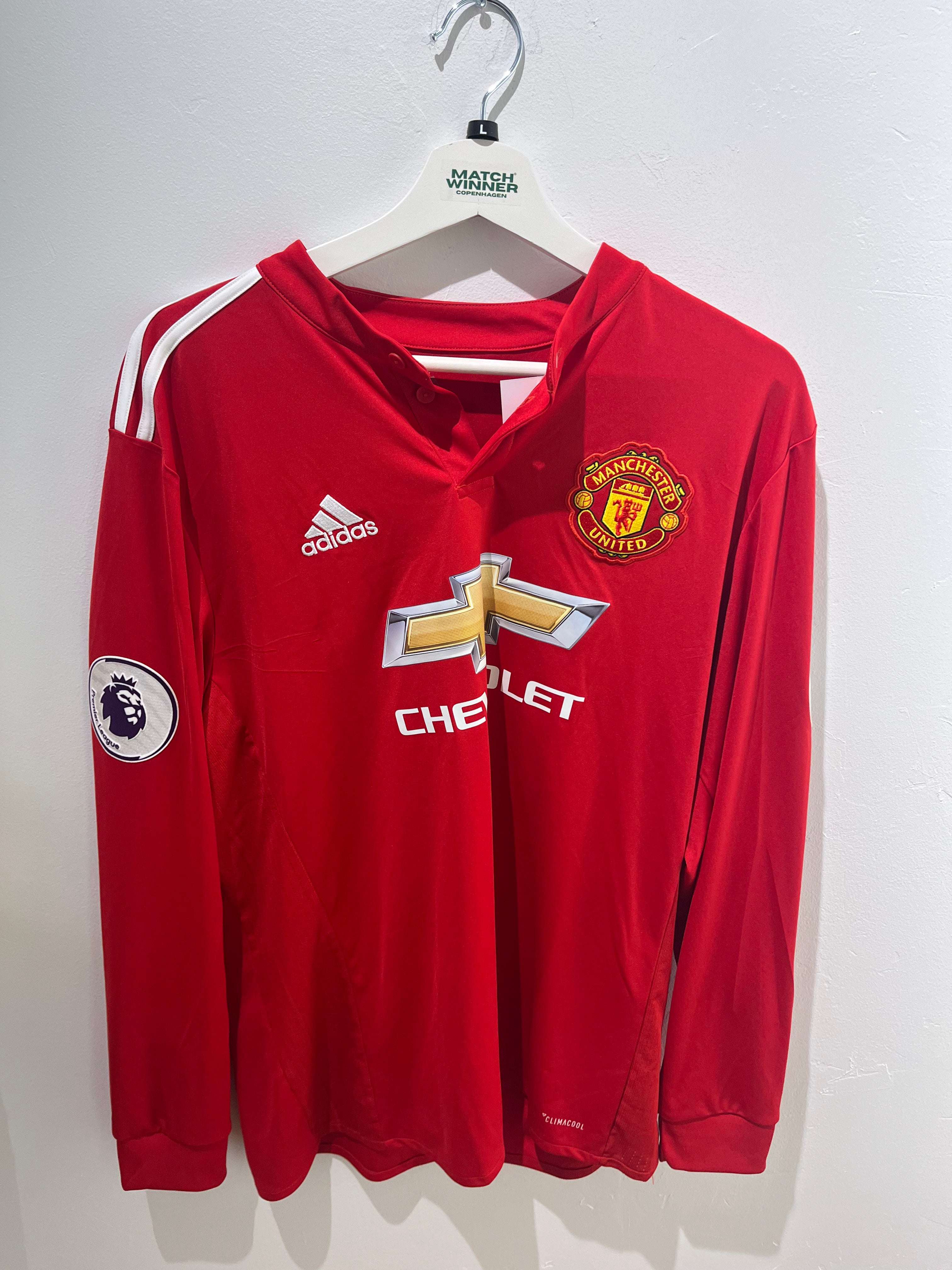 Forsiden af Herrera Manchester United Hjemme 2017/18 L trøjen med klublogo og sponsor fra Premier League sæsonen.